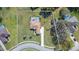 Aerial view of the property highlighting the pool, spacious backyard, and long driveway at 27941 Austin Woods Dr, Dade City, FL 33525
