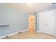 Empty bedroom with blue walls, base molding, and tile flooring at 27941 Austin Woods Dr, Dade City, FL 33525
