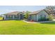 Charming single-story home with a well-manicured lawn and inviting curb appeal at 27941 Austin Woods Dr, Dade City, FL 33525
