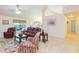 Bright living room with tile floors and comfortable seating, great for relaxation at 27941 Austin Woods Dr, Dade City, FL 33525