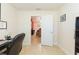 Bright home office leading into a living area with tile flooring at 27941 Austin Woods Dr, Dade City, FL 33525