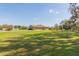 A large lawn and landscaped yard for this home at 27941 Austin Woods Dr, Dade City, FL 33525