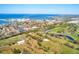 Beautiful aerial image showcasing this vibrant waterfront community that includes a golf course at 300 Promenade Dr # 106, Dunedin, FL 34698