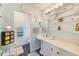 Classic bathroom with pedestal sink, open shelving, and a tiled shower area, exuding charm at 300 Promenade Dr # 106, Dunedin, FL 34698