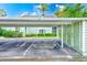 Assigned carport parking space, providing covered parking for residents and guests at 300 Promenade Dr # 106, Dunedin, FL 34698