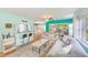 Inviting living room features wood floors and plenty of natural light at 300 Promenade Dr # 106, Dunedin, FL 34698