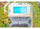 Aerial view of sparkling community pool with ample lounge seating at 300 Promenade Dr # 106, Dunedin, FL 34698