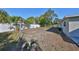 The backyard features a white fence with a clothesline at 3218 N 16Th St, Tampa, FL 33605