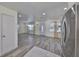 Bright living room showcasing new flooring and a modern front door with decorative glass at 3218 N 16Th St, Tampa, FL 33605