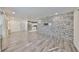 An open-concept living room flows seamlessly to the modern kitchen with stainless steel appliances at 3218 N 16Th St, Tampa, FL 33605