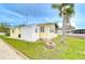 Lovely property with firepit, storage shed, and mature trees by the peaceful canal at 35246 Tiffani Ct, Zephyrhills, FL 33541