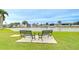 Serene waterfront community featuring benches overlooking a calm waterway and well-maintained landscaping at 35246 Tiffani Ct, Zephyrhills, FL 33541