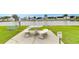 Community area featuring a marble table set and beautiful waterfront views at 35246 Tiffani Ct, Zephyrhills, FL 33541