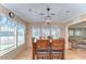 Formal dining room with seating for six and large windows at 35246 Tiffani Ct, Zephyrhills, FL 33541