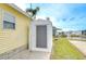 Exterior shot of canal-front home and storage shed, offering both utility and curb appeal at 35246 Tiffani Ct, Zephyrhills, FL 33541