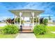 Charming community gazebo offers a serene space to relax with lush landscaping and waterway views at 35246 Tiffani Ct, Zephyrhills, FL 33541