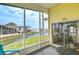 Covered screened porch offering picturesque waterfront scenery at 35246 Tiffani Ct, Zephyrhills, FL 33541