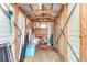 Organized storage shed interior with ample shelving, storage solutions, and natural light at 35246 Tiffani Ct, Zephyrhills, FL 33541