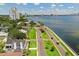An aerial view shows a waterfront home overlooking the water and skyline at 3801 Bayshore Blvd, Tampa, FL 33611