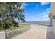 Spacious balcony with decorative railings overlooking the bay and downtown skyline on a sunny day at 3801 Bayshore Blvd, Tampa, FL 33611