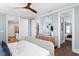 Bright bedroom featuring hardwood floors, light blue walls, stylish decor, and walk-in closet at 3801 Bayshore Blvd, Tampa, FL 33611