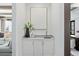 Contemporary Butler's Pantry featuring white cabinets, modern art, and a decorative plant at 3801 Bayshore Blvd, Tampa, FL 33611