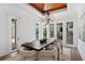 Bright dining room featuring wood ceiling and large windows overlooking the pool area at 3801 Bayshore Blvd, Tampa, FL 33611