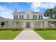 Stately two-story home with manicured lawn, symmetrical landscaping, and inviting entrance at 3801 Bayshore Blvd, Tampa, FL 33611