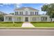 Beautiful two-story home with manicured lawn, a walkway, and a double-door entryway at 3801 Bayshore Blvd, Tampa, FL 33611