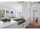Stylish kitchen featuring white countertops, premium appliances, and an adjacent living area with water views at 3801 Bayshore Blvd, Tampa, FL 33611