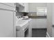 Well-organized laundry room with white cabinets and modern appliances at 3801 Bayshore Blvd, Tampa, FL 33611