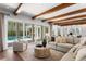 Inviting living room boasting a cozy sectional, stylish furnishings, and pool view at 3801 Bayshore Blvd, Tampa, FL 33611