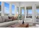 Bright living area with large windows offering panoramic water views and comfortable seating at 3801 Bayshore Blvd, Tampa, FL 33611