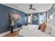 Blue bedroom with an upholstered bed, console table and decor at 3801 Bayshore Blvd, Tampa, FL 33611