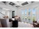Stylish office with coffered ceilings, modern lighting, and views of the water at 3801 Bayshore Blvd, Tampa, FL 33611