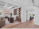 Home office featuring custom built-ins, a fireplace, and views into the backyard at 3801 Bayshore Blvd, Tampa, FL 33611