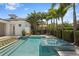 Gorgeous pool and spa with blue tile, complemented by palm trees and lush landscaping at 3801 Bayshore Blvd, Tampa, FL 33611
