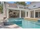 Gorgeous outdoor pool and spa area with a full outdoor kitchen and covered dining space at 3801 Bayshore Blvd, Tampa, FL 33611