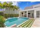 Backyard oasis with a modern pool, spa, outdoor kitchen, and entertainment area at 3801 Bayshore Blvd, Tampa, FL 33611