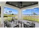 Covered porch with seating area offering scenic views of the water and skyline at 3801 Bayshore Blvd, Tampa, FL 33611