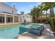 Sparkling backyard pool and spa with stylish tile and manicured backyard at 3801 Bayshore Blvd, Tampa, FL 33611