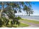 Scenic waterfront view from property featuring bay, skyline, and waterfront pedestrian and bike path at 3801 Bayshore Blvd, Tampa, FL 33611