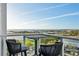 Balcony with seating and scenic water views, perfect for relaxation and enjoying sunsets at 400 Beach Ne Dr # 1202, St Petersburg, FL 33701