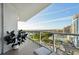 Balcony featuring glass railings and stunning city skyline views, with comfortable outdoor seating at 400 Beach Ne Dr # 1202, St Petersburg, FL 33701