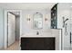 Elegant bathroom showcasing sleek vanity with marble countertop, modern fixtures, and tiled shower at 400 Beach Ne Dr # 1202, St Petersburg, FL 33701