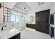 Modern bathroom featuring a glass-enclosed shower, double vanity, and sleek dark wood cabinetry at 400 Beach Ne Dr # 1202, St Petersburg, FL 33701