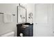 Modern bathroom features a sleek vanity with granite countertop, framed mirror, and updated lighting at 400 Beach Ne Dr # 1202, St Petersburg, FL 33701