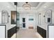 Modern bathroom featuring a dual vanity, large mirrors, spacious walk-in shower with black hardware at 400 Beach Ne Dr # 1202, St Petersburg, FL 33701