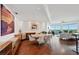Bright dining room with an exquisite painting and modern furnishings overlooking the city and ocean at 400 Beach Ne Dr # 1202, St Petersburg, FL 33701