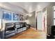 A home theater with leather recliners, movie posters, and wooden floors provides an entertainment experience at 400 Beach Ne Dr # 1202, St Petersburg, FL 33701